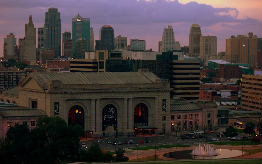 Kansas City skyline above historic Union Station at dusk.